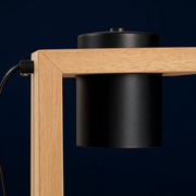 Close-up of the wooden frame and black cylindrical heating head